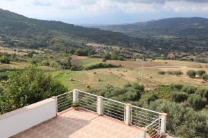 a balcony of a house with a view of a valley at TENUTA BILUCCIO B & B in Roccadaspide