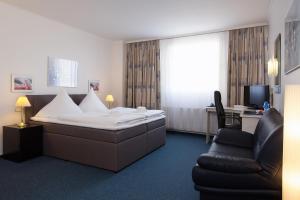 Postel nebo postele na pokoji v ubytování Hotel Berliner Bär