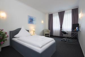 Postel nebo postele na pokoji v ubytování Hotel Berliner Bär