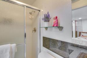 a bathroom with a shower and a toilet and a mirror at Miami Gardens Studio with Patio 12 Mi to Ocean! in Miami Gardens