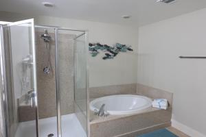 a bathroom with a shower and a sink at Laketown Wharf 1233 luxury condo in Panama City Beach
