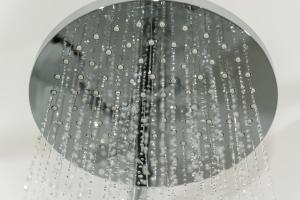 a shower head with water droplets on it at Dorfmeister Business Hotel B&B in Weikersdorf am Steinfelde
