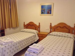 Postel nebo postele na pokoji v ubytování Pension La Milagrosa
