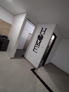 an open door in a room with the word exit at Hermosa y acogedora casa in Acacías