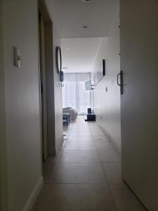 an empty hallway with a room with a window at Venezuela Apartament Premiun in Buenos Aires