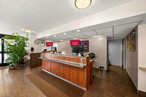 a lobby with a cashier counter in a hotel at Red Roof Inn Dallas - DFW Airport North in Irving