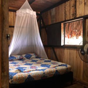 En eller flere senge i et værelse på Pacific Dream Hostal
