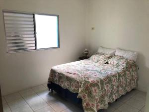 Ένα ή περισσότερα κρεβάτια σε δωμάτιο στο Sitio em São Francisco Xavier