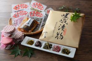 a table with a basket of food and a sign at Hotel Binario Saga Arashiyama in Kyoto