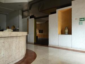 Ο χώρος του λόμπι ή της ρεσεψιόν στο Hotel Inn Sur