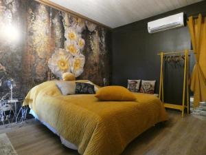 a bedroom with a bed with a yellow blanket at Guestroom Janville-en-Beauce, 1 pièce, 3 personnes - FR-1-581-112 in Janville