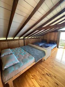 Cama ou camas em um quarto em Chalet Fara Hinano, Vue Océan