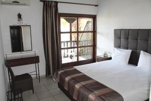 Cama ou camas em um quarto em Villa Frideriki