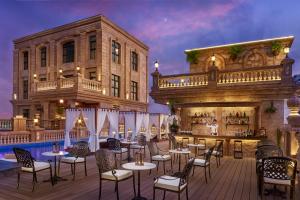 a rendering of the rooftop patio of a hotel with a bar at Anik Palace Hotel in Phnom Penh