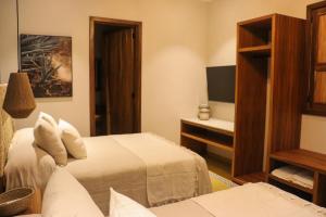 Postel nebo postele na pokoji v ubytování Hotel Boutique Gloriagave