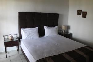 Cama ou camas em um quarto em Villa Frideriki