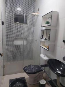 Ванна кімната в Casa agradável, com piscina aquecida.