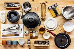 a table with plates and utensils on it at Uwanosora Bed&BBQ&Sauna in Shizuoka