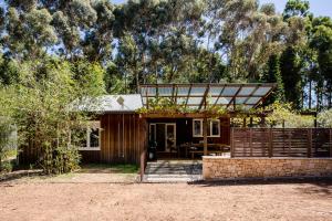 a small cabin with a porch and a fence at Barn Haus in Margaret River Town