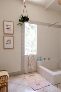 a bathroom with a tub and a window at Barn Haus in Margaret River Town