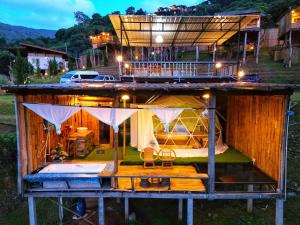 a house with a balcony on top of it at บ้านลิ้นจี่ 