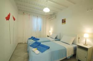 מיטה או מיטות בחדר ב-Lino Apartments