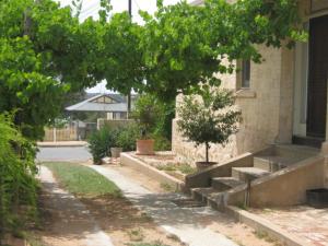 a building with a bunch of steps next to a house at Amalie Cottage Waikerie Unit 1 in Waikerie