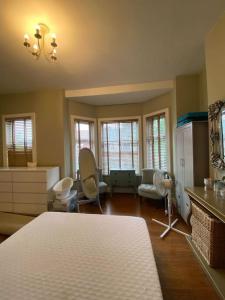 a bedroom with a bed and a living room at Delightful Victorian House in Manchester