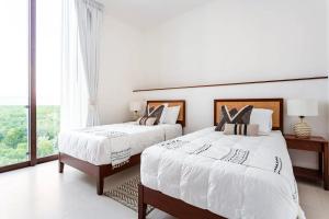 Postel nebo postele na pokoji v ubytování Condo in Playa del Carmen Mayakoba + 35 fotografií