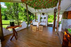 a tent with a wooden floor and a table and chairs at Amancay House, Jacuzzi and Pool in San Cristóbal