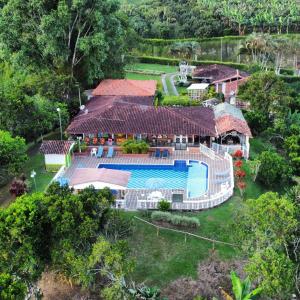 an aerial view of a house with a swimming pool at Villa Luzandi in Quimbaya