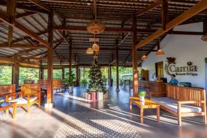 a lobby with a christmas tree in the middle at Camia Resort & Spa in Phu Quoc