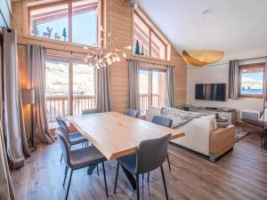 a living room with a table and chairs and a couch at Chalet Les Avanchers-Valmorel, 4 pièces, 6 personnes - FR-1-356-376 in Les Avanchers