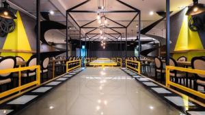 a dining room with yellow and black chairs at 凝萃文旅 台中車站店 NCH-Business Hotel in Taichung