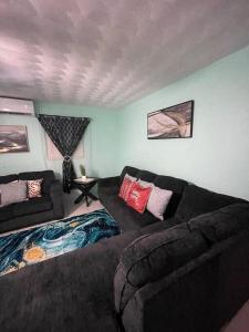 a living room with a couch and a couches at Wally's Haven in Nassau