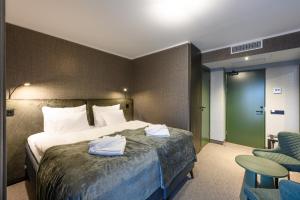 Ugandi Hotel客房内的一张或多张床位