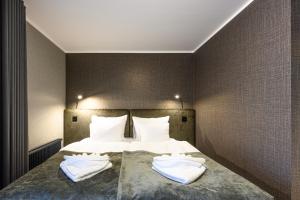 Ugandi Hotel客房内的一张或多张床位