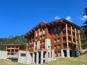 a large building on top of a hill at Appartement Les Arcs 1800, 4 pièces, 6 personnes - FR-1-352-85 in Bourg-Saint-Maurice