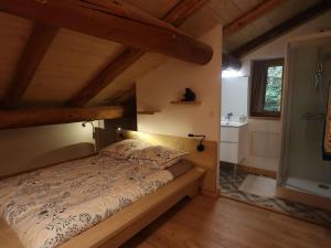 a bedroom with a bed in a room with wooden ceilings at Chalet Hauteluce, 4 pièces, 7 personnes - FR-1-342-309 in Hauteluce