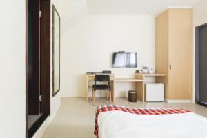 Postel nebo postele na pokoji v ubytování Tropical Low Boundary B&B