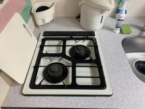 フューデイズコンドミニアム定山渓102号室的厨房或小厨房