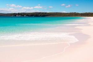 a beach with white sand and turquoise water at Hyams Beach House B - Brand new lux beach oasis in Hyams Beach