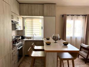 a kitchen with a table with two bowls on it at Mahajanga Residences in Mahajanga
