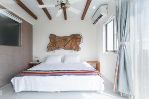 Postel nebo postele na pokoji v ubytování Tropical Low Boundary B&B