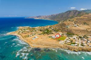 an aerial view of a small island in the ocean at Villa Diana Seaside in Pomos