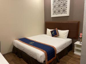 Postel nebo postele na pokoji v ubytování Pinus Hotel