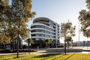 a round building with a lot of windows at Shellharbour Lakeview Apartment in Barrack Point