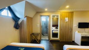 TV a/nebo společenská místnost v ubytování Pinus Hotel