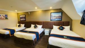 Postel nebo postele na pokoji v ubytování Pinus Hotel