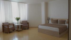 Voodi või voodid majutusasutuse Inga Hotel Yerevan toas